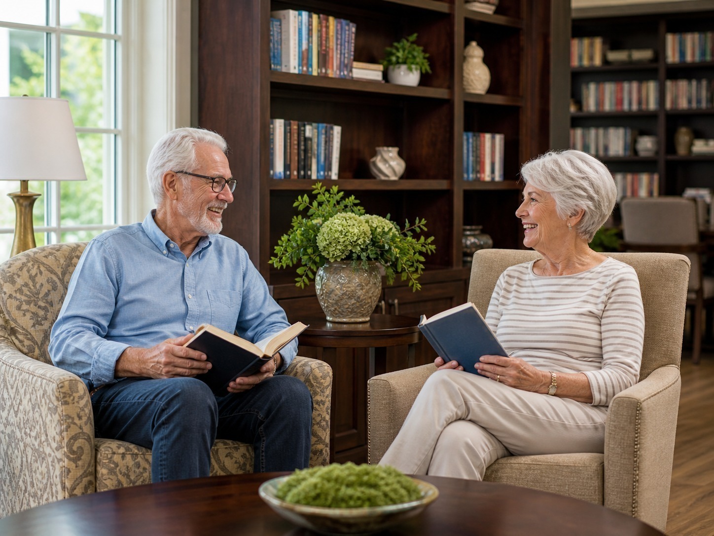 Older adults and a staff member looking at a community activity calendar in a senior living setting